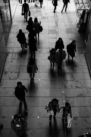 Silhouettes of shoppers