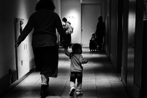 Mother and daughter walking hand in hand