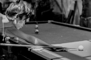 Young man holding cue stick