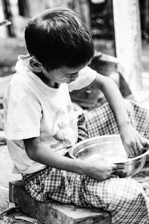Boy holding bowl