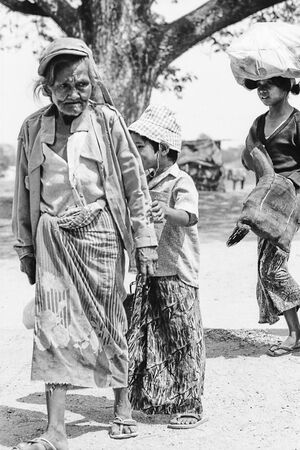Older woman with grim look