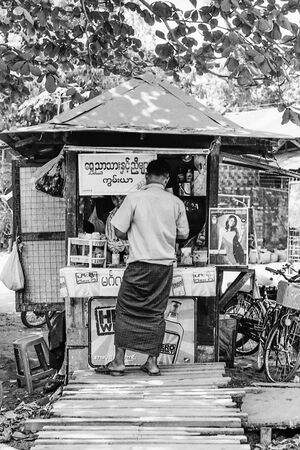 Man buying at kiosk