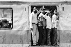 passengers on train coming to Chhatrapati Shivaji Terminus