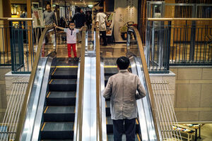Boy watching escalator