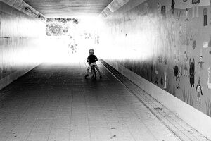 Little boy in tunnel