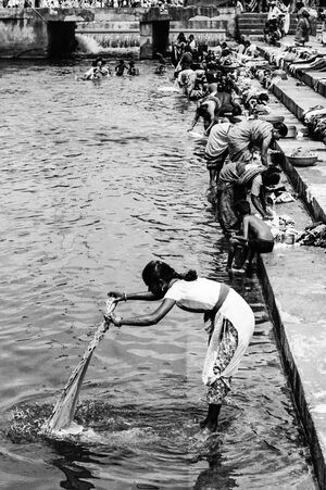 Woman washing in river