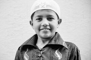 Boy wearing Taqiyah