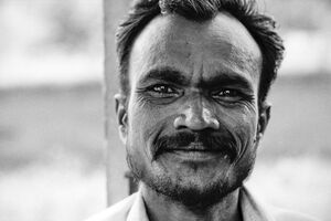 Man smiling faintly