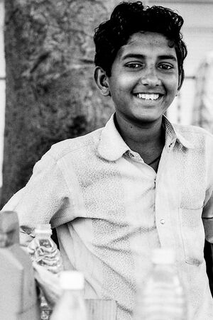 Boy selling beverages