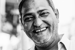 Grin of shop owner