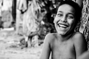 boy laughing from ear to ear