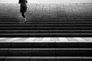 Woman climbing staircase