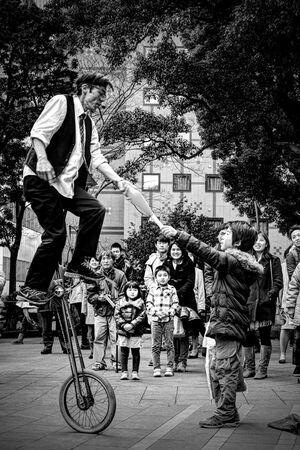 Boy and street performer