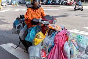 Motorbike with many plastic bag