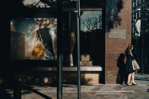 Woman in a corner of a street of Marunouchi