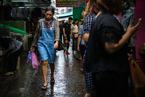 Woman walking with head down