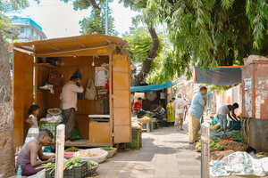 Sidewalk lined with street vendors