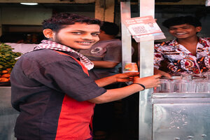 Young man at the juice stand