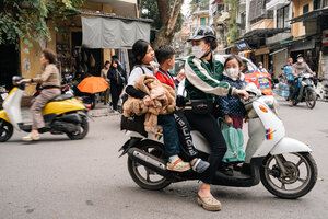 Family of four on one motorcycle
