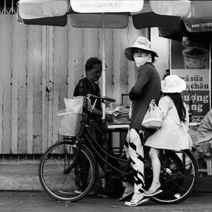 Mother and daughter on same bicycle