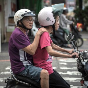 Old couple on a motorbike