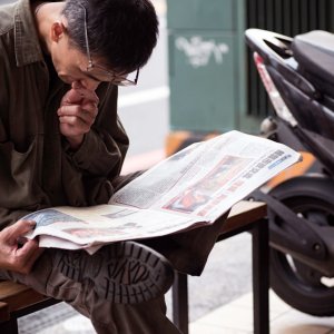 Man reading newspaper