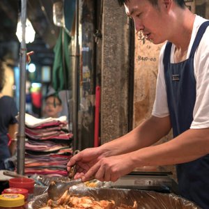 man selling Korean pickle