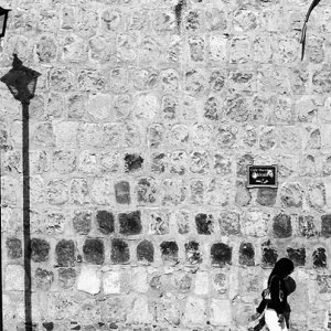 Street lamp in front of wall