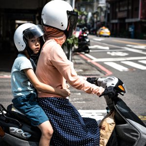 Parent and child on same motorbike