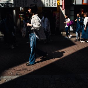 Woman walking in sunny place