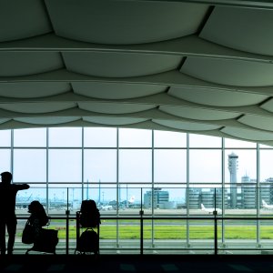 Silhouetted men waiting for boarding time