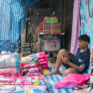 Man selling bedclothes