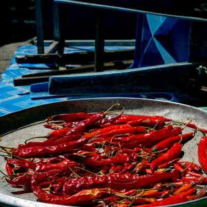 Red peppers being dried in sun in Khlong Toei Market