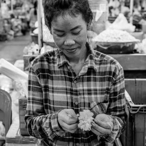 Woman making flowerage by hand