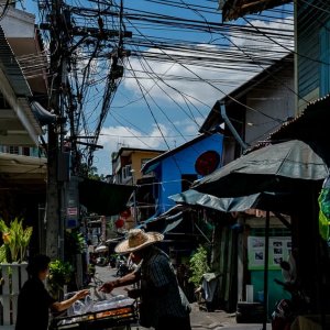 Stall in narrow lane with many electric wires