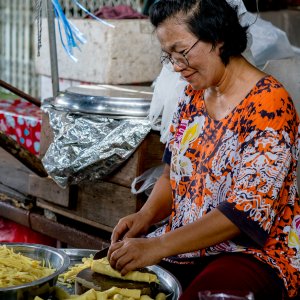 Woman cutting bamboo sprouts