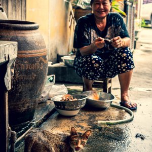 Woman and cat in lane