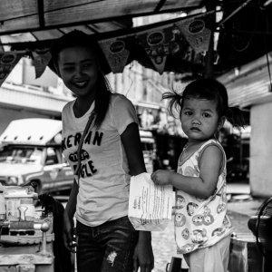 Little girl playing in food stall