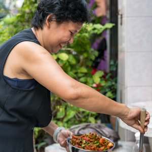 Woman scooping cuisine