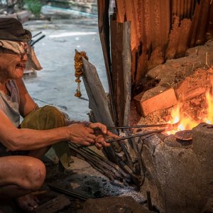Blacksmith heating in fire pit