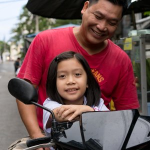 Father and daughter on motorbike