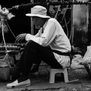 Street vendor doing business with carrying pole