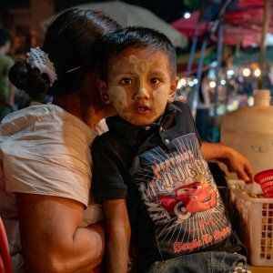 Boy painted Thanaka on face