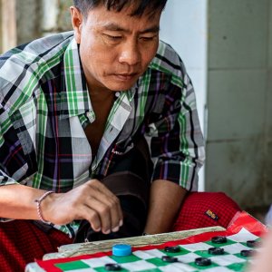 Man playing checkers