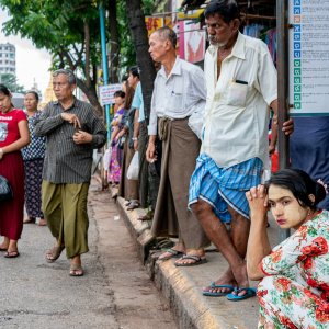 People waiting for bus at bus stop