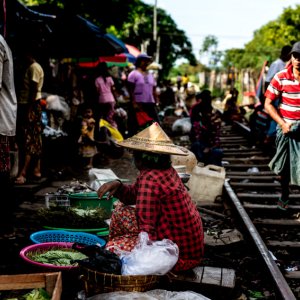 Woman doing business beside railway track