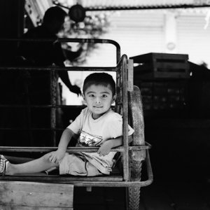 Boy relaxing on cart