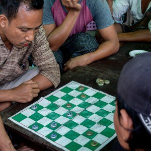 Men playing checkers