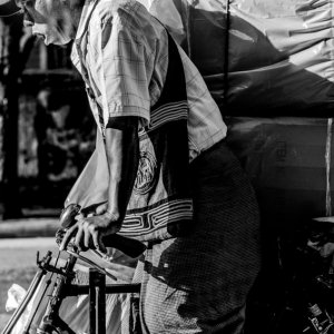 Man carrying big burdens by bicycle