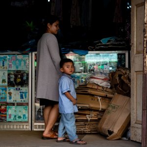 Mother and boy in children\'s clothing store